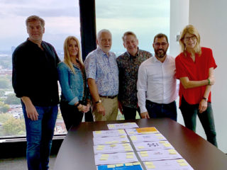 Kat McCord and other leaders in the design industry judge logos for the 10th Wolda